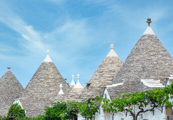Trulli houses in main touristic district of Alberobello beautiful old historic town, Apulia region,...