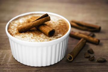 tapioca porridge, traditional Brazilian cassava sweet, usually prepared in granulated form, with cinnamon powder and cinnamon stick