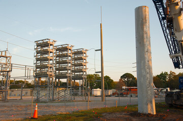 Electric Substation High Power Lines Blue Sky construction and instal of of pole