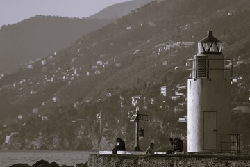 lighthouse on the shore of the sea