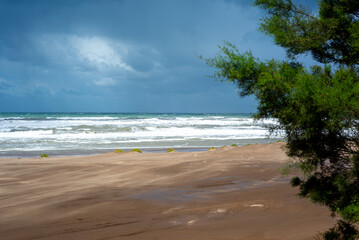 View of the beach with storm over the sea