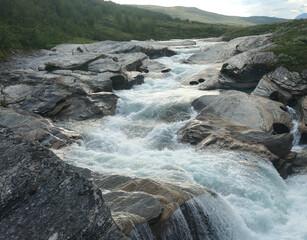 River in the mountains with polished rocks 