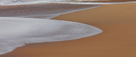 vague sur la sable