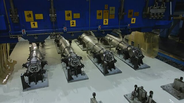 The milling machine processes pieces of metal. Metalurgical plant inside