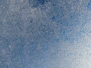 Texture of ice on the window that can be used as a handwritten background