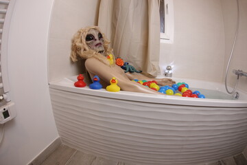 Spooky female alien in the bathtub
