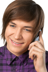 College aged male using a cell phone