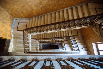 Top view of old vintage decorated staircase in abandoned mansion