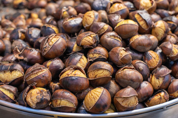Roasted sweet chestnuts close up. Food background. Healthy eating. Organic food. Protein source. 