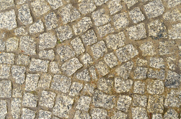 Abstract background of old cobblestone close up.
