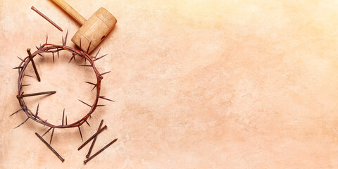 Crown of thorns, nails and mallet on beige background with space for text. Good Friday concept