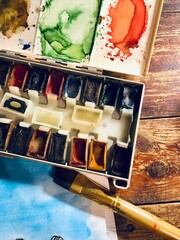 watercolor paints and brushes