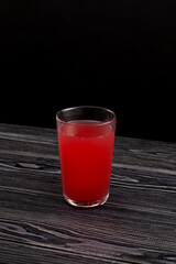 Glass of Red fruit Tepache drink. Fermented beverage made from peel and rind of pineapples. Tepache...