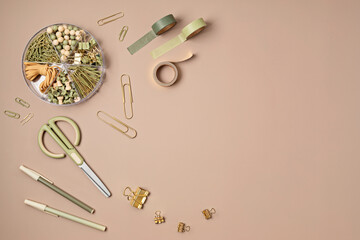 Flatlay of office supplies made of recycled materials on beige background with copy space for text. Banner, flat lay, top view