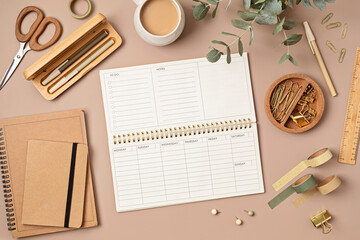 Mockup of  weekly planner and office stationery with copy space for text. Flat lay, top view photo...