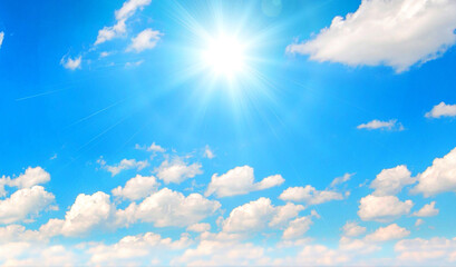 Naklejka na ściany i meble Blue cloudy sky with sun