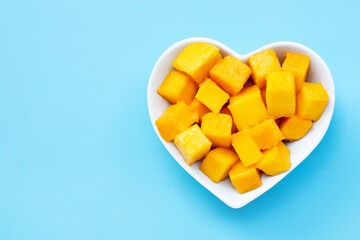 Tropical fruit, Mango on blue background. Top view