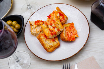 Plate with a Catalan snack of bread with tomatoes...