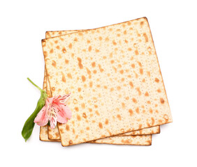 Jewish flatbread matza for Passover and beautiful alstroemeria flower on white background