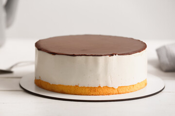 Delicious birds milk cake on light wooden table