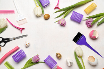 Frame made of hairdresser's tools, Easter eggs and tulips on white background