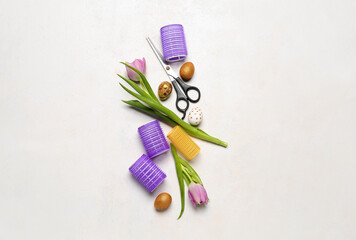 Scissors with curlers, tulips and Easter eggs on white background
