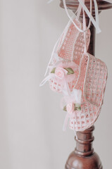 Wicker pink shoes as the decor in the bedroom in the daylight.