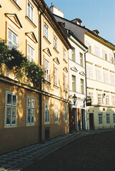 Obraz premium typical Prague cityscape. You can see Prague house facades and the Charles Bridge, also you can feel the Prague old town flair.