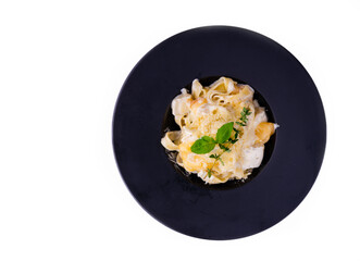 pasta with bechamel sauce with thyme and mint on white background for restaurant menu