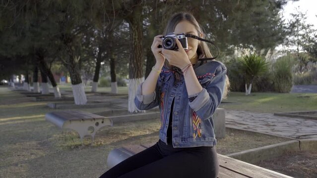A Girl Photographing the Park During Sunset as Hobbie