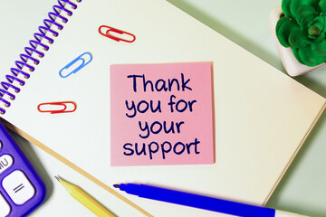 Thank you for your support text write on paper as background with pen and book