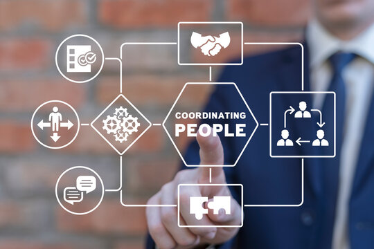 Businessman using virtual touch screen presses inscription: COORDINATING PEOPLE. Concept of coordinating people. Internship and leadership coaching and education conceptual background.