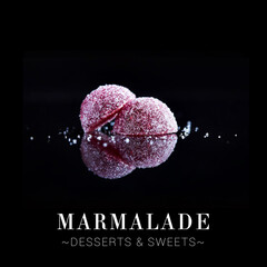 Jelly marmalade dessert isolated on black background. Close-up to Colourful sweets with reflection...