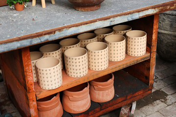 flower pots on shelf 