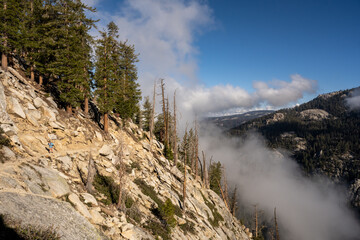 Woman Hikes Along Cliffside in Sequoia National Park