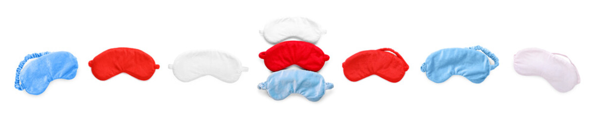 Set of soft sleep masks on white background, top view