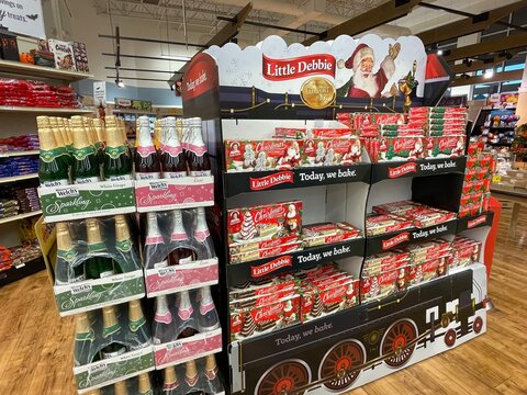 Grocery store Little Debbie snack cakes holiday display Welches sparkling drinks