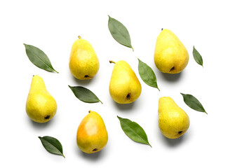 Composition with ripe pears and green leaves on white background