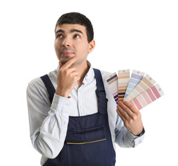 Thoughtful male painter with color palettes on white background