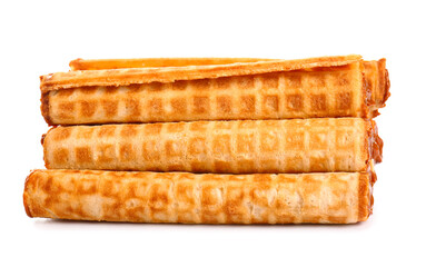 Stack of wafer rolls with boiled condensed milk isolated on white background