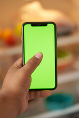 hand holding smart phone with screen