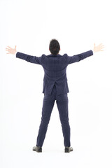 A man in a suit expressing joy