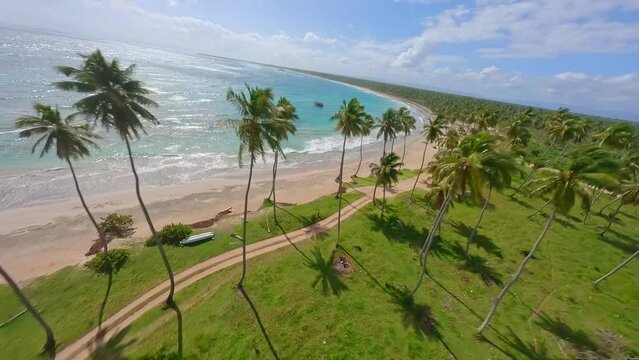 Red barco pescador boat fishing in tropical waters, Playa Los Coquitos; FPV drone