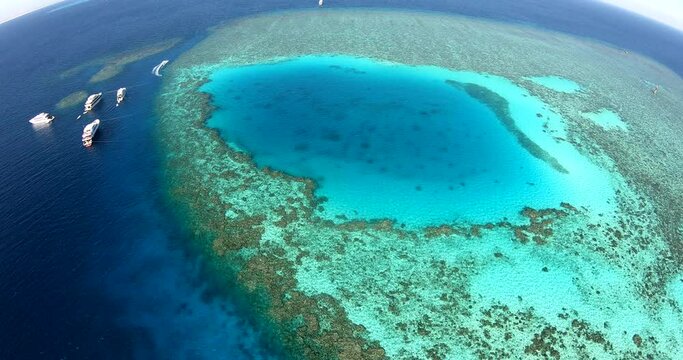 Aerial Drone Shot for Abu Nuhas Coral Reef Dive Site in `the Red Sea of Egypt. The reef is a navigation hazard because it projects into the shipping channel, as evidenced by seven shipwrecks.