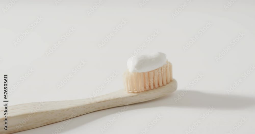 Poster close up of toothbrush with toothpaste on white background with copy space