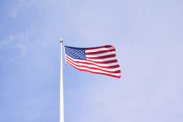 Fototapeta premium Proudly Waving: The American Flag Symbolizes Unity, Freedom, and Patriotism