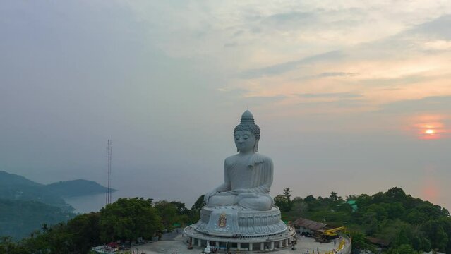 aerial Hyperlapse view around Phuket big Buddha in beautiful sunset..360 degree view on Phuket big Buddha viewpoint..Video clips for travel and religious ideas..smooth sea and sky background.