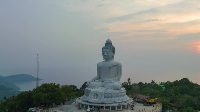 aerial Hyperlapse view around Phuket big Buddha in beautiful sunset..360 degree view on Phuket big Buddha viewpoint..Video clips for travel and religious ideas..smooth sea and sky background.
