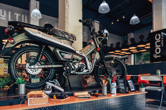 NAKHON PATHOM,THAILAND-JANUARY 7, 2023 : View of Honda Super Cub C 125 Motorcycle classic 125cc. collection on display for sale at CUB House Nakhon Pathom Honda x Greyhound Coffee. Concept retro.