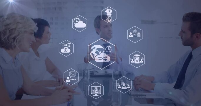 Animation of icons and data processing over diverse business people working in office
